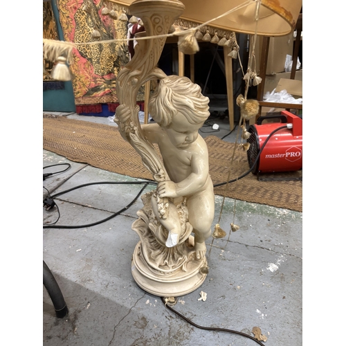 96 - A LARGE CHERUB LAMP BASE WITH SILK LINED SHADE (A/F)