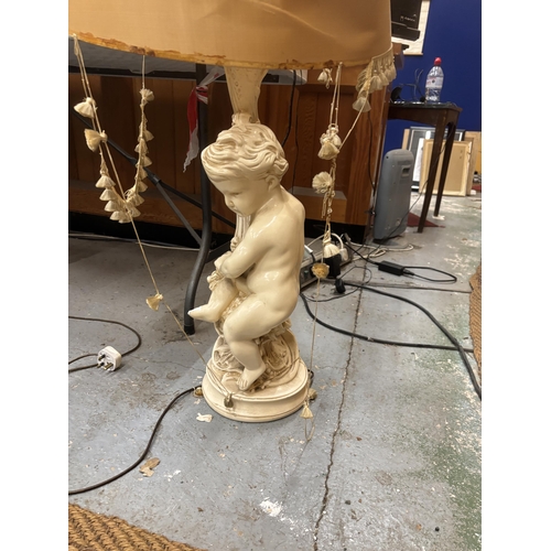 96 - A LARGE CHERUB LAMP BASE WITH SILK LINED SHADE (A/F)