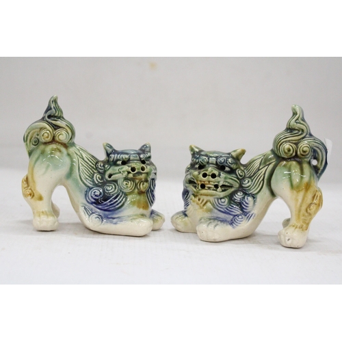 165 - A PAIR OF ORIENTAL FOO DOGS