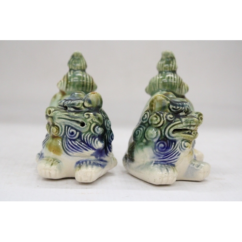 165 - A PAIR OF ORIENTAL FOO DOGS