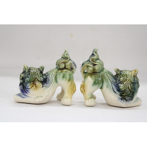 165 - A PAIR OF ORIENTAL FOO DOGS