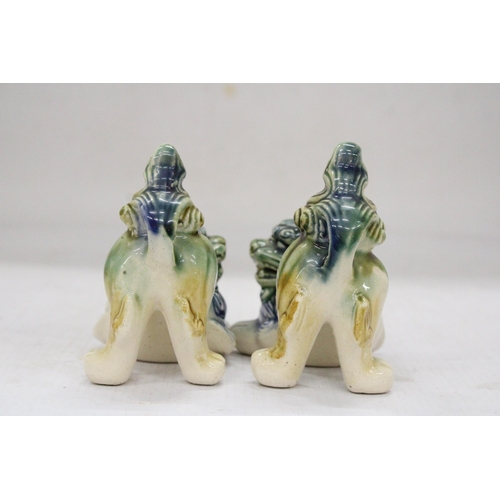 165 - A PAIR OF ORIENTAL FOO DOGS