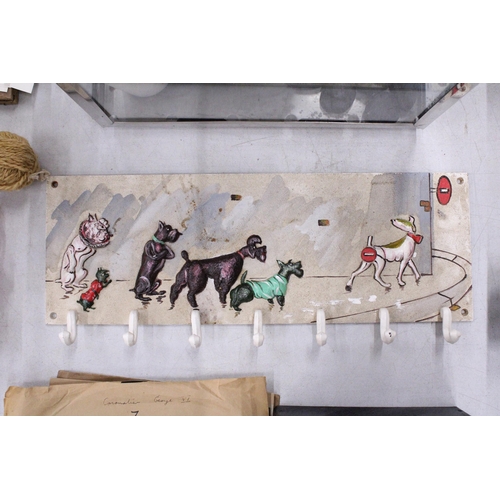 254 - A CAST IRON COAT RACK WITH DOGS DESIGN (BORIS O'KLEIN)