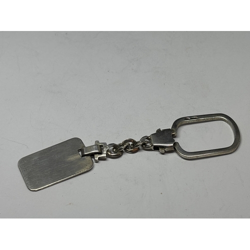 679 - A MARKED SILVER KEY RING