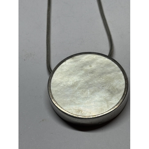 705 - A MARKED SILVER NECKLACE WITH MOTHER OF PEARL PENDANT