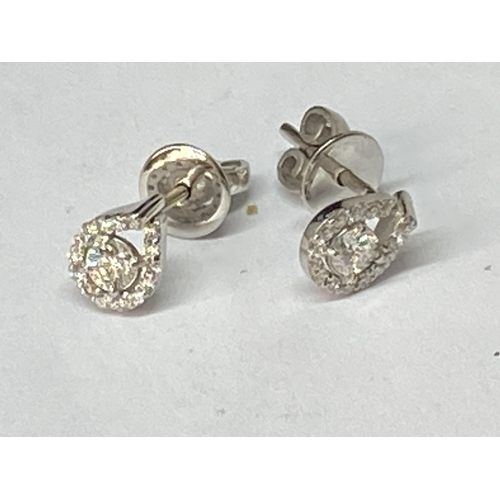 773 - A PAIR OF 18 CARAT WHITE GOLD EARRINGS STUDDED WITH ROUND BRILLIANT CUT NATURAL DIAMONDS 0.30 CARATS... 