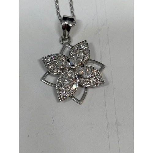 774 - AN 18 CARAT WHITE GOLD PENDANT WITH CHAIN STUDDED WITH MARQUISE AND ROUND BRILLIANT CUT NATURAL DIAM... 