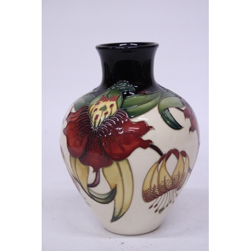 813 - A MOORCROFT ANNA LILY VASE 18 CM