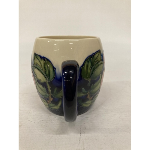 816 - A MOORCROFT MUG WILD ROSE PATTERN