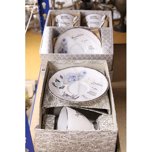 933 - TWO VINTAGE BOXED SILVER WEDDING CERAMIC CUPS AND SAUCERS