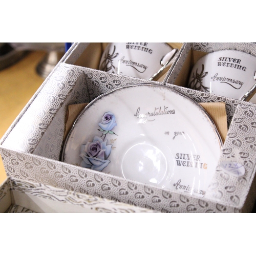 933 - TWO VINTAGE BOXED SILVER WEDDING CERAMIC CUPS AND SAUCERS