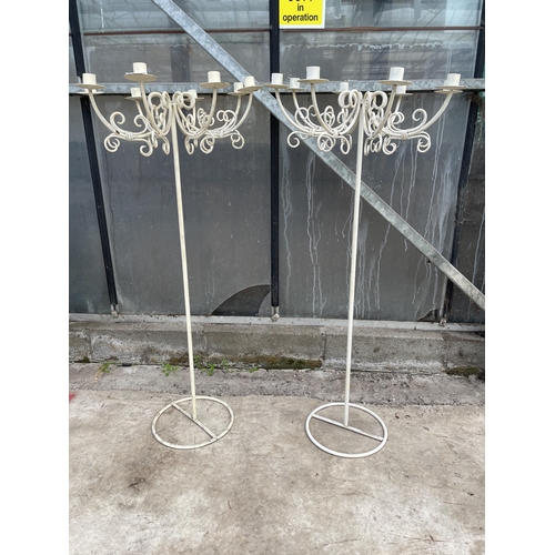 1503 - A PAIR OF WHITE PAINT METAL EIGHT BRANCH CANDLESTICKS