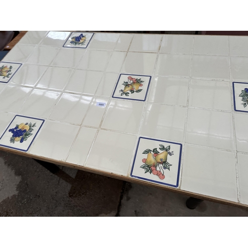 3094 - A TILED TOP DINING TABLE 51.5