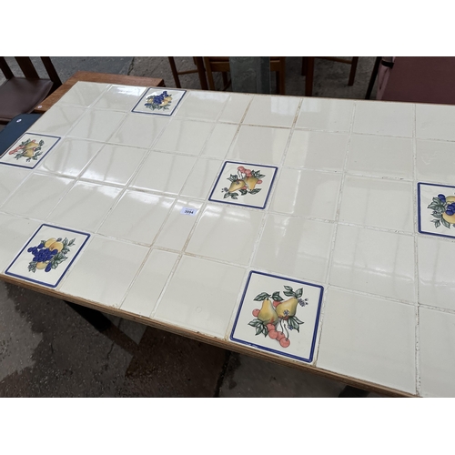 3094 - A TILED TOP DINING TABLE 51.5