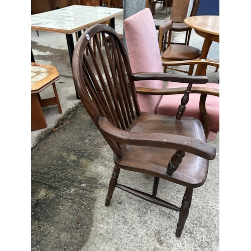 3098 - A WINDSOR STYLE CARVER CHAIR AND FIRESIDE CHAIR.