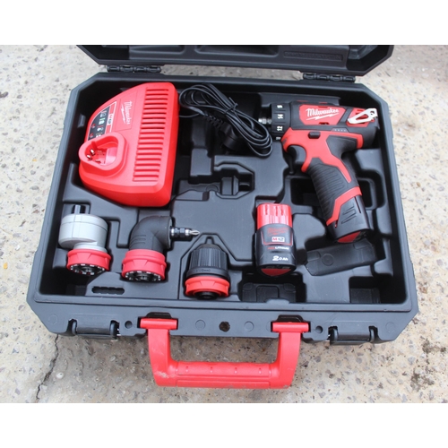 38 - AS NEW MILWAUKEE DRILL SET BATTERY AND CHARGER  NO VAT