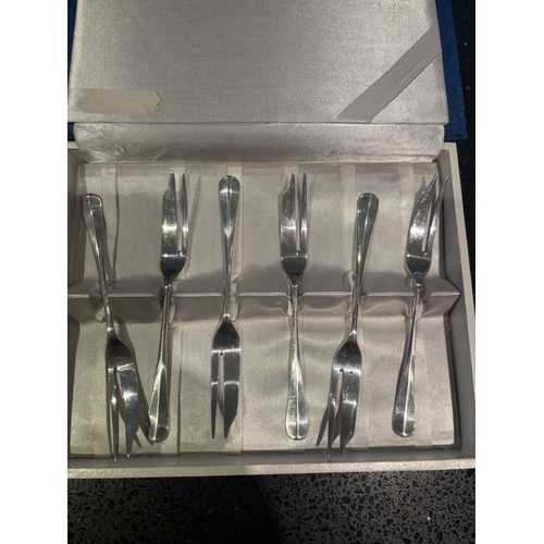 103 - A SET OF SIX HALLMARKED BIRMINGHAM 1924 SILVER FISH FORKS MAKER W H H IN A PRESENTATION BOX