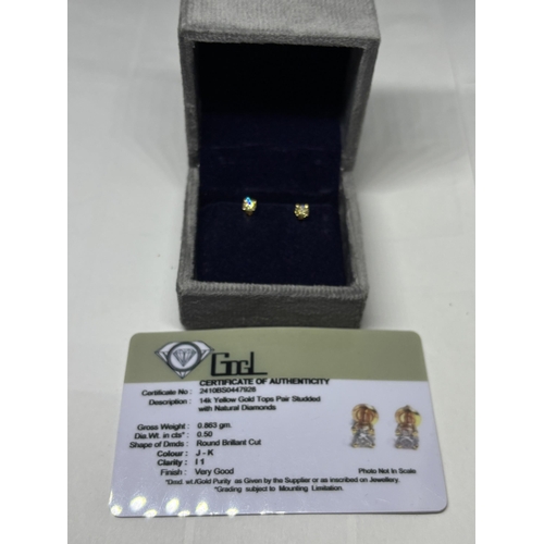 519 - A PAIR OF MARKED 14K SOLITAIRE EARRINGS WITH SCREW ON BUTTERFLY IN A PRESENTATION BOX WITH GEMOLOGY ... 