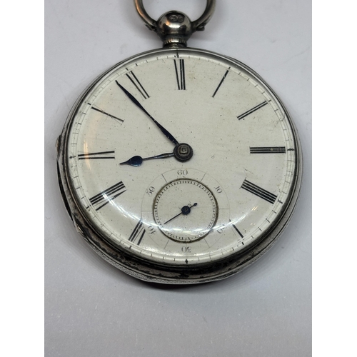 526 - A HALLMARKED LONDON GEORGIAN SILVER POCKET WATCH WITH WHITE ENAMEL FACE, SUB DIAL AND ROMAN NUMERALS... 