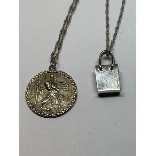 528 - FOUR SILVER NECKLACES WITH PENDANTS TO INCLUDE A LOCKET AND ST CHRISTOPHER