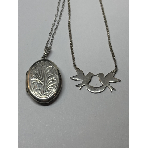 528 - FOUR SILVER NECKLACES WITH PENDANTS TO INCLUDE A LOCKET AND ST CHRISTOPHER