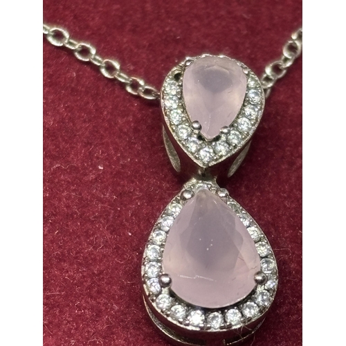 544 - A SILVER AND PINK STONE NECKLACE AND EARRING SET IN A PRESENTATION BOX