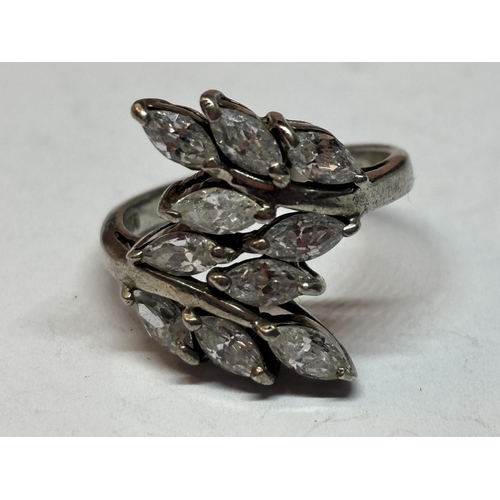 545 - A SILVER DRESS RING WITH CLEAR STONE PETAL DESIGN IN A PRESENTATION BOX