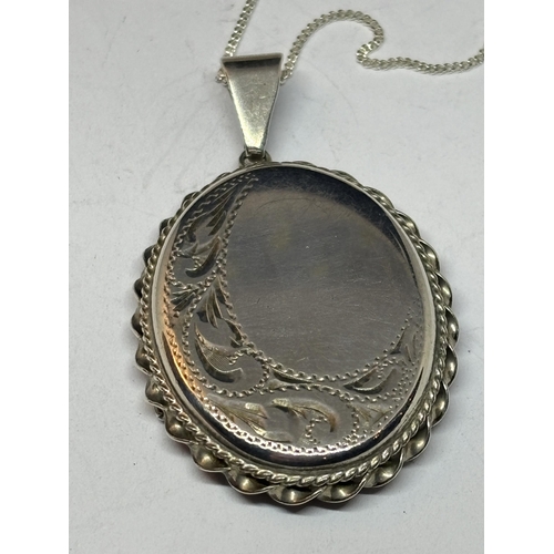 548 - A SILVER NECKLACE WITH SILVER LOCKET IN A PRESENTATION BOX