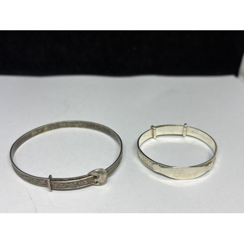 554 - THREE SILVER BANGLES