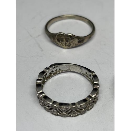 557 - SIX VARIOUS SILVER RINGS