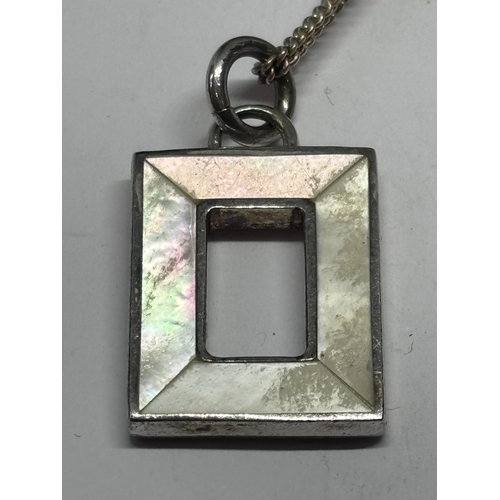 558 - A SILVER AND MOTHER OF PEARL NECKLACE AND BRACELET IN A PRESENTATION BOX