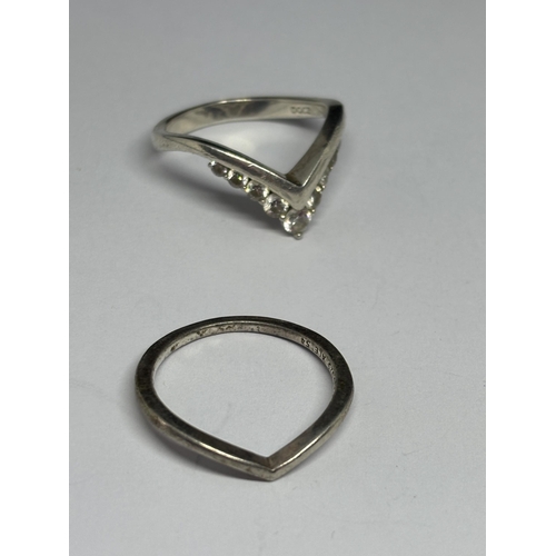 574 - SIX VARIOUS SILVER RINGS