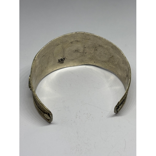 579 - AN ASIAN SILVER BANGLE