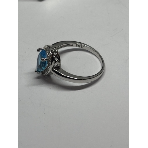 621 - A MARKED 925 SILVER RING WITH A TEARDROP BLUE TOPAZ STONE IN A PRESENTATION BOX