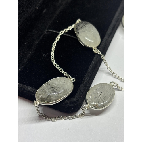 628 - A MARKED SILVER NECKLACE WITH GREY/BLACK STONES IN A PRESENTATION BOX