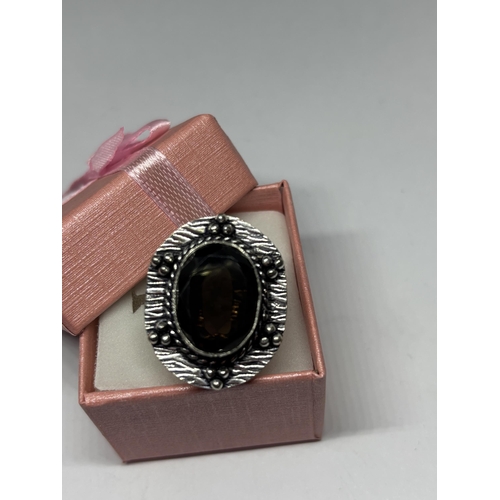 639 - A MARKED 925 SILVER RING WITH BROWN STONE IN A PRESENTATION BOX