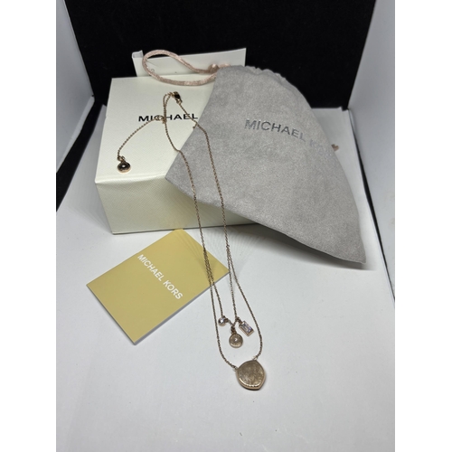 660 - A MICHAEL KORS DOUBLE STRAND CLEARSTONE NECKLACE WITH BOX AND POUCH