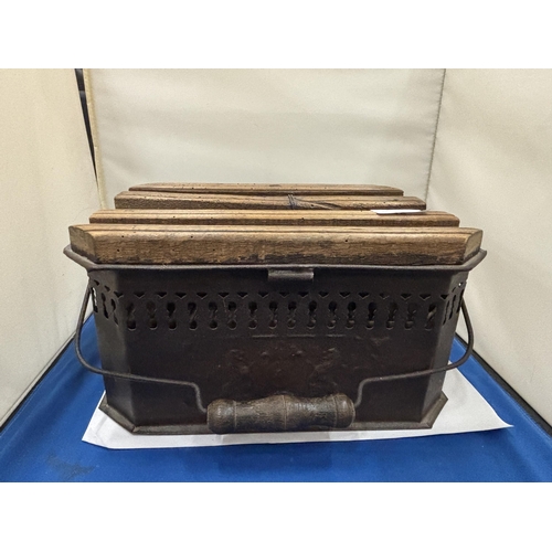 10 - AN ANTIQUE FOOT WARMER HEATER CARRIAGE BRAZIER WITH BLACK COATED METAL WITH FRETWORK AND THREE WOODE... 