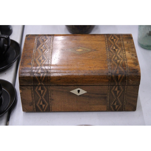 113 - A WALNUT INLAID  DOMED WORK BOX WITH GEOMETRIC MARQUETRY TOGETHER WITH AN ANTIQUE OAK AND BRASS VICT... 