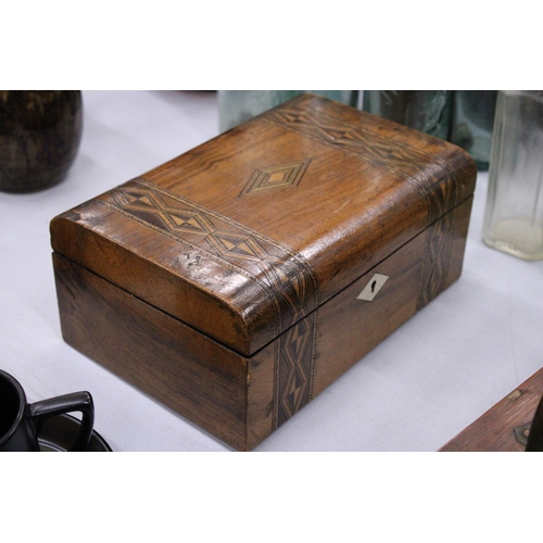 113 - A WALNUT INLAID  DOMED WORK BOX WITH GEOMETRIC MARQUETRY TOGETHER WITH AN ANTIQUE OAK AND BRASS VICT... 