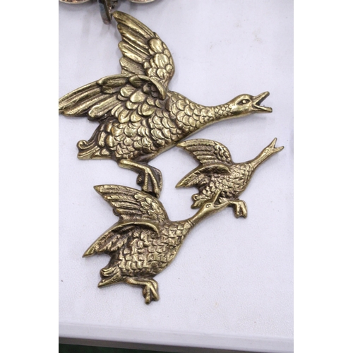 121 - A SET OF THREE VINTAGE FLYING DUCKS WALL HANGINGS