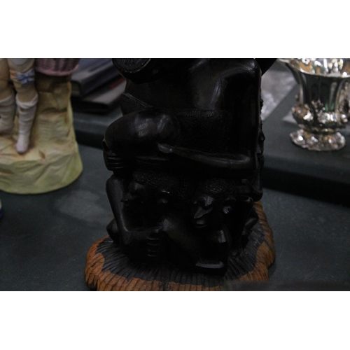 159 - A CARVED HARDWOOD AFRICAN SCULPTURE OF A FAMILY GROUP