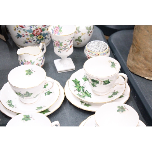 168 - A QUANTITY OF CROWN ROYAL IVY PATTERNED CHINA TO INCLUDE CUPS, SAUCERS AND SIDE PLATES PLUS A LARGE ... 