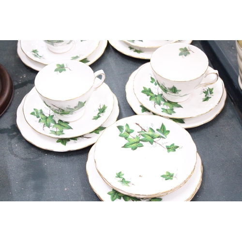 168 - A QUANTITY OF CROWN ROYAL IVY PATTERNED CHINA TO INCLUDE CUPS, SAUCERS AND SIDE PLATES PLUS A LARGE ... 