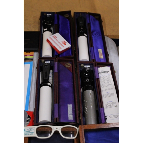 18 - A COLLECTION OF VINTAGE OPTICIANS EQUIPMENT TO INCLUDE BOXED OPTHALMOSCOPES, TWO OPTHALMIC TRIAL LEN... 