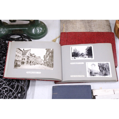 22 - FOUR VINTAGE PHOTOGRAPH ALBUMS FEATURING POSTCARDS AND PHOTOS FROM AUSTRIA AND SWITZERLAND IN THE 19... 