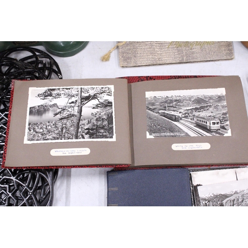 22 - FOUR VINTAGE PHOTOGRAPH ALBUMS FEATURING POSTCARDS AND PHOTOS FROM AUSTRIA AND SWITZERLAND IN THE 19... 