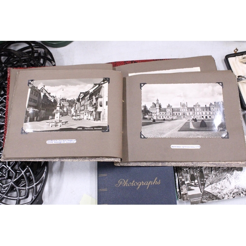 22 - FOUR VINTAGE PHOTOGRAPH ALBUMS FEATURING POSTCARDS AND PHOTOS FROM AUSTRIA AND SWITZERLAND IN THE 19... 