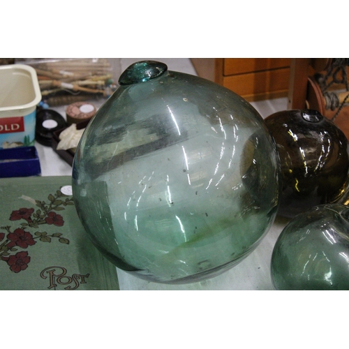 37 - TWO SMALL AND ONE LARGE VINTAGE GLASS FLOATS/BUOYS