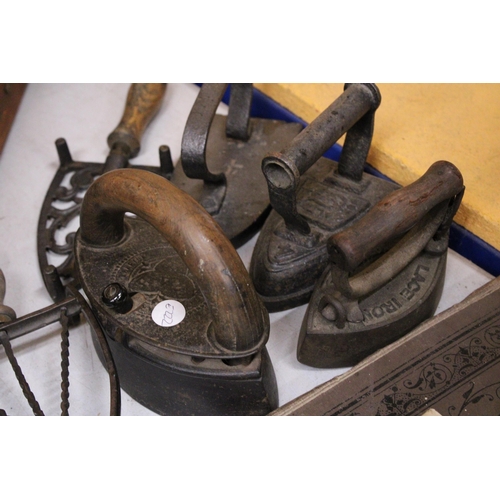 45 - FOUR VINTAGE CAST IRONS TO INCLUDE A CHARCOAL IRON, LACE IRON, ETC PLUS TWO IRON TRIVETS